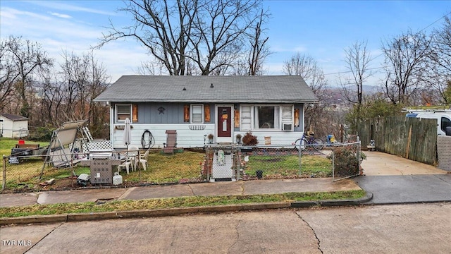 bungalow-style house featuring cooling unit