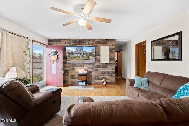 living room with hardwood / wood-style flooring and ceiling fan