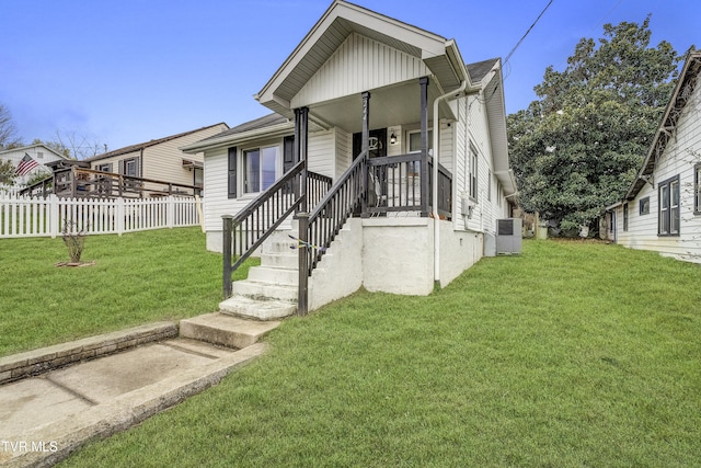 view of front of house featuring a front yard and covered porch