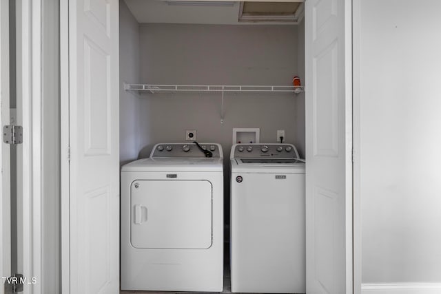 laundry room featuring washing machine and dryer