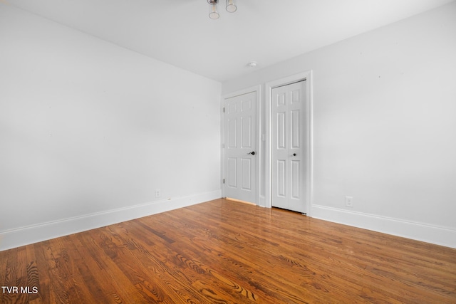 unfurnished room featuring hardwood / wood-style flooring