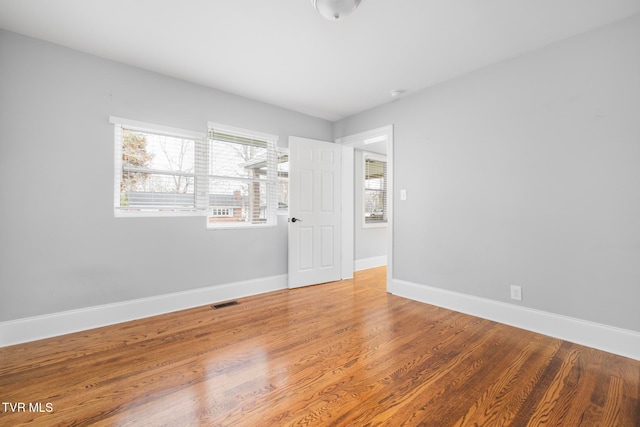 empty room featuring hardwood / wood-style flooring