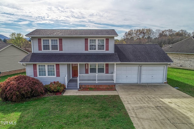 front of property featuring covered porch, a garage, and a front yard