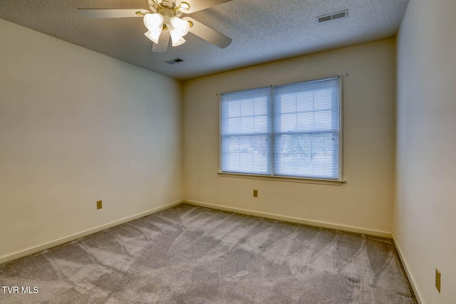 spare room with light carpet, a textured ceiling, and ceiling fan