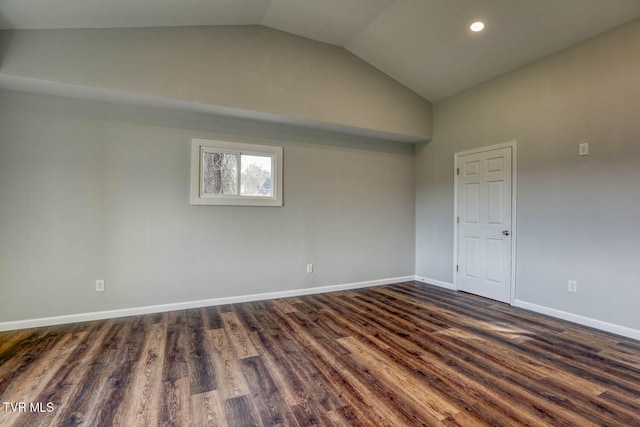 unfurnished room with vaulted ceiling, dark wood-type flooring, recessed lighting, and baseboards