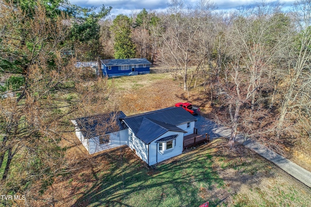 drone / aerial view with a view of trees