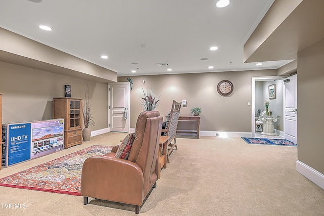 carpeted living room with crown molding