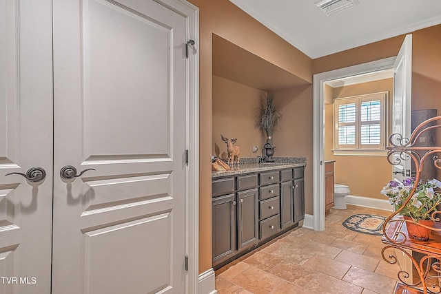 bathroom with vanity and toilet