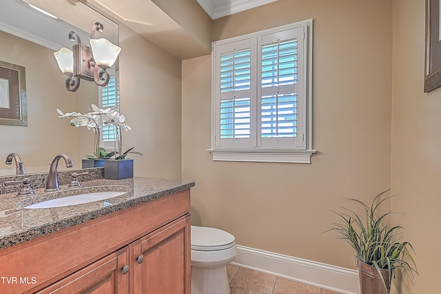 bathroom featuring tile patterned flooring, vanity, toilet, and crown molding