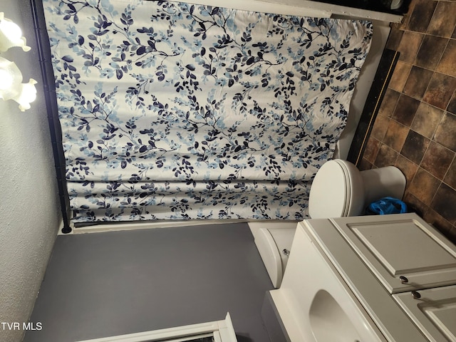 bathroom featuring washer / clothes dryer