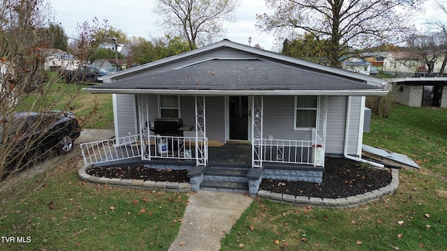 bungalow-style house with a front yard