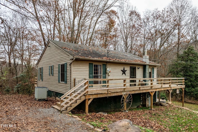 back of property featuring central AC and a wooden deck