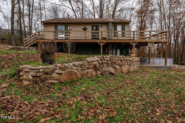 back of property featuring a deck