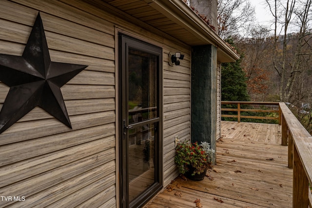 property entrance with a deck