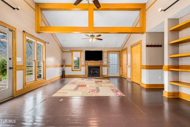 unfurnished living room featuring beamed ceiling, ceiling fan, dark wood-type flooring, and high vaulted ceiling