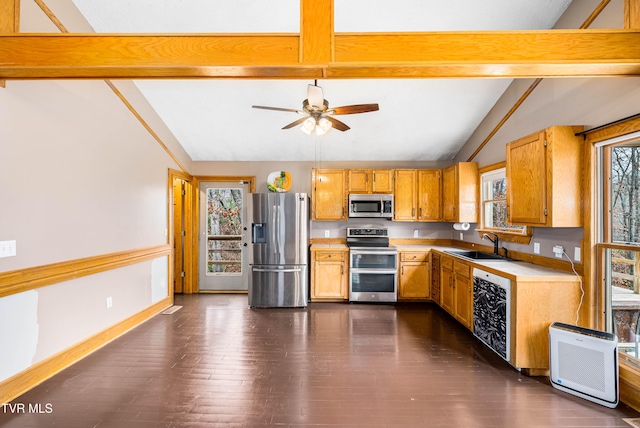 kitchen with stainless steel appliances, ceiling fan, sink, vaulted ceiling with beams, and dark hardwood / wood-style floors