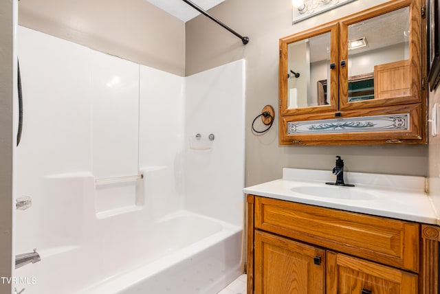 bathroom featuring bathtub / shower combination and vanity