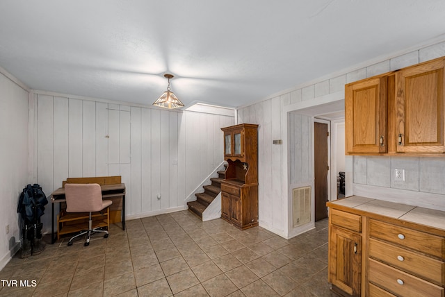 office area with wooden walls