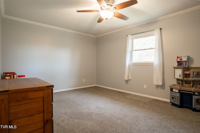 interior space with dark colored carpet, ceiling fan, and ornamental molding