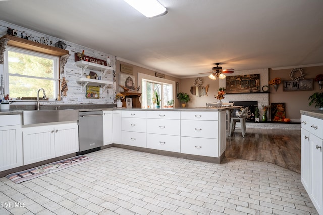 kitchen with white cabinetry, a healthy amount of sunlight, and sink