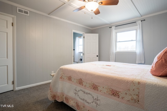 bedroom featuring ceiling fan, crown molding, carpet floors, and wood walls