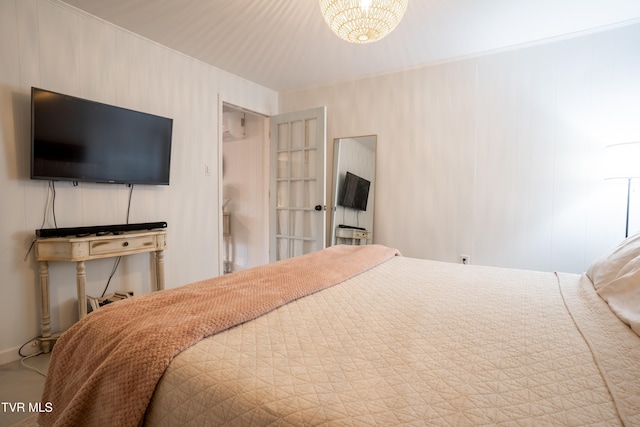 bedroom featuring a chandelier