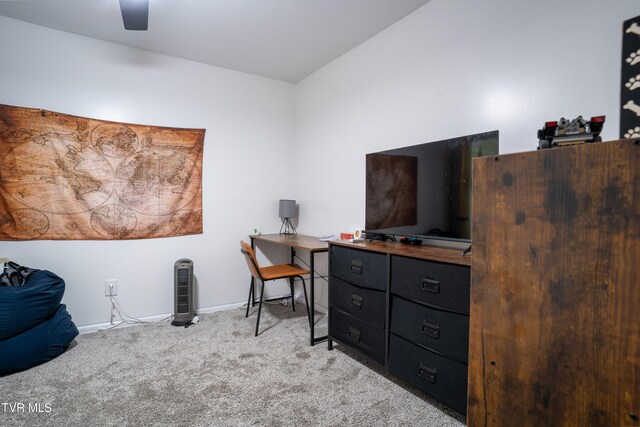 carpeted home office with ceiling fan