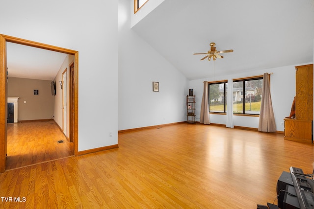 unfurnished living room with ceiling fan, light hardwood / wood-style flooring, and high vaulted ceiling