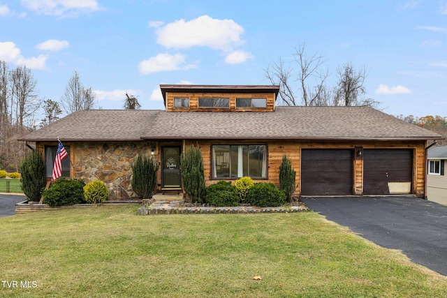 view of front facade with a garage and a front lawn