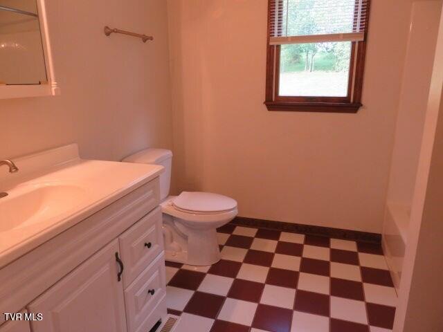 full bathroom featuring vanity, toilet, and tub / shower combination