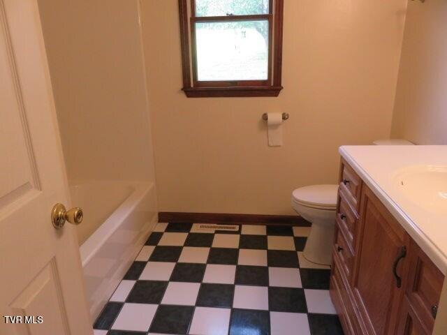 bathroom with vanity and toilet