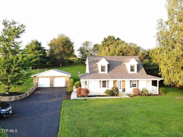 cape cod-style house with a porch, a front yard, an outdoor structure, and a garage