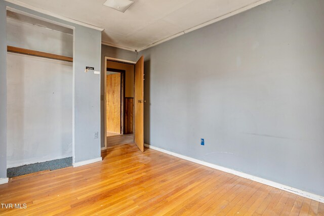 1667 Bristol Caverns Hwy, Bristol, TN 37620 - unfurnished bedroom with light wood-style floors, baseboards, and a closet