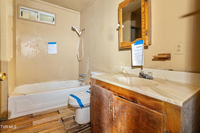 1667 Bristol Caverns Hwy, Bristol, TN 37620 - bathroom featuring vanity, toilet, wood finished floors, and washtub / shower combination