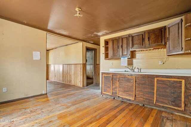 1667 Bristol Caverns Hwy, Bristol, TN 37620 - kitchen featuring open shelves, light wood-style floors, decorative backsplash, and light countertops