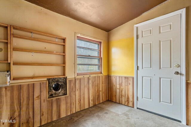 1667 Bristol Caverns Hwy, Bristol, TN 37620 - unfurnished room featuring wainscoting, concrete flooring, and wood walls
