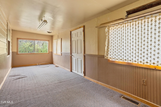 1667 Bristol Caverns Hwy, Bristol, TN 37620 - carpeted spare room with a wainscoted wall