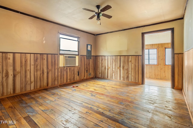 1667 Bristol Caverns Hwy, Bristol, TN 37620 - spare room with hardwood / wood-style flooring, wainscoting, ceiling fan, healthy amount of natural light, and wooden walls