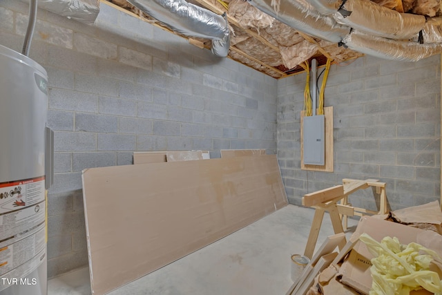 basement featuring electric panel and water heater