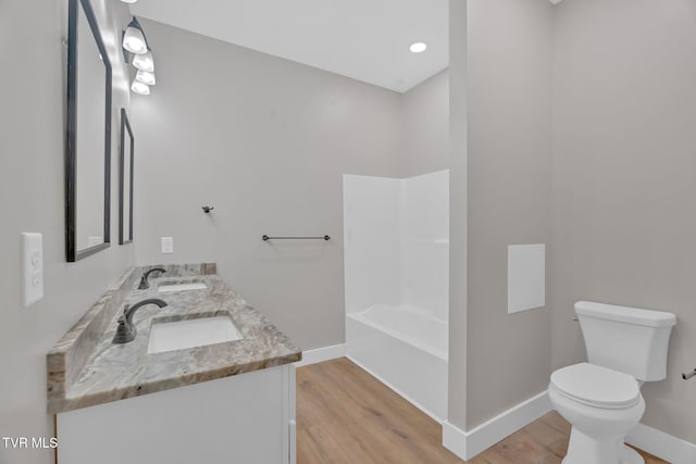 bathroom featuring hardwood / wood-style floors, vanity, and toilet