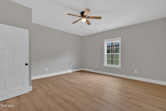 spare room with ceiling fan and light hardwood / wood-style flooring