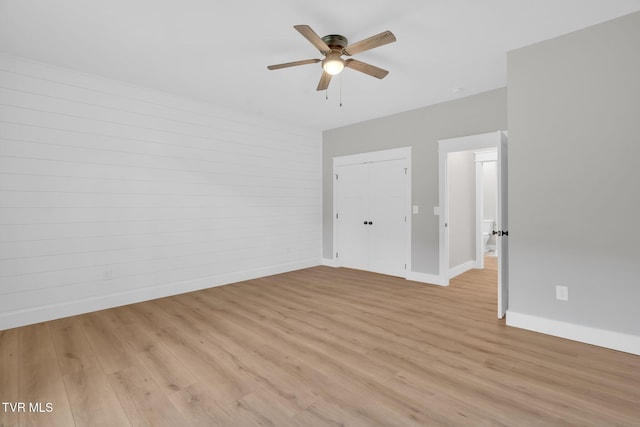 spare room featuring ceiling fan and light wood-type flooring