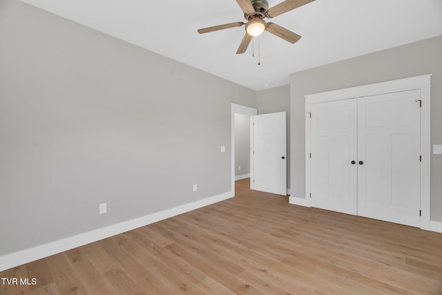 unfurnished bedroom featuring a closet, ceiling fan, and light hardwood / wood-style flooring