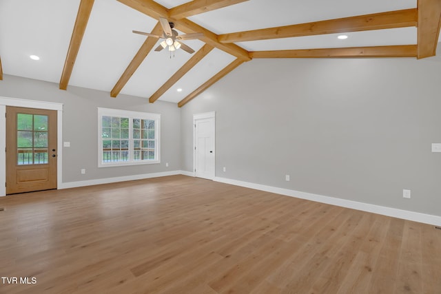 unfurnished living room with ceiling fan, lofted ceiling with beams, and light wood-type flooring