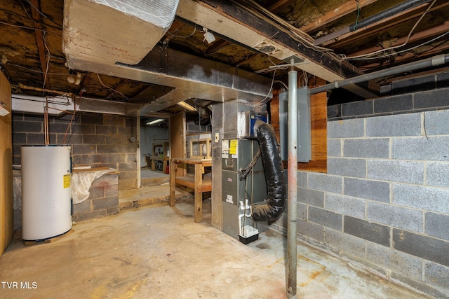 basement featuring heating unit and water heater