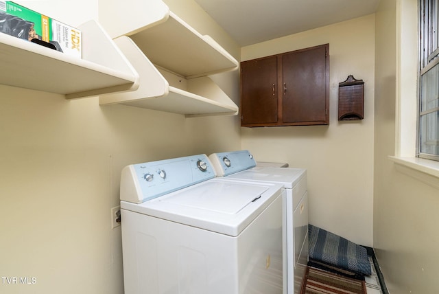 clothes washing area featuring washer and clothes dryer