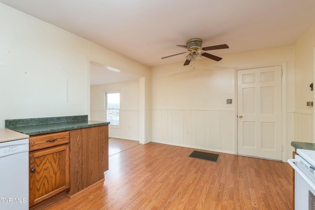 kitchen featuring white dishwasher, light hardwood / wood-style flooring, and ceiling fan