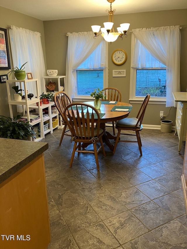 dining space with a chandelier