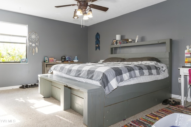 bedroom with light carpet and ceiling fan