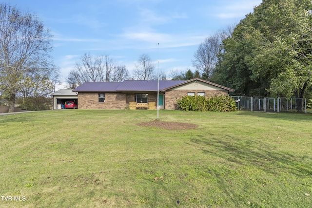 view of front of house featuring a garage and a front yard